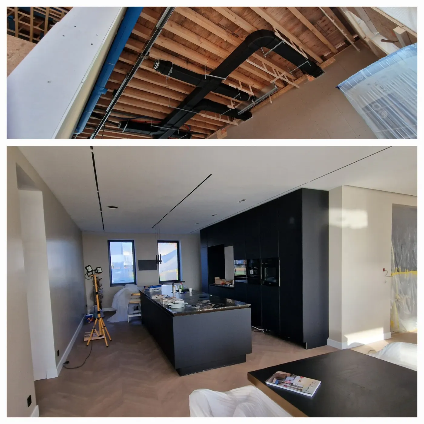 Luchtkanalen in het open plafond en de afgewerkte keuken van de villa